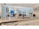 Bright space with granite counters overlooks a dining table and chairs at 5920 Midnight Pass Rd # 406, Sarasota, FL 34242