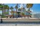 Outdoor grill area near the beach, picnic tables and benches for community gatherings at 5920 Midnight Pass Rd # 406, Sarasota, FL 34242