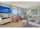 Bright living area with entertainment center, comfortable seating, and tasteful decor for relaxing at 5920 Midnight Pass Rd # 406, Sarasota, FL 34242