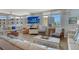 Bright living room with a large window, comfortable seating, and stylish decor creates an inviting atmosphere at 5920 Midnight Pass Rd # 406, Sarasota, FL 34242