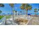 Community outdoor shower with paver flooring near beach at 5920 Midnight Pass Rd # 406, Sarasota, FL 34242