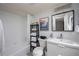 Bathroom featuring a tub/shower combination with sleek fixtures and ample storage at 6100 Gulfport S Blvd # 117, Gulfport, FL 33707