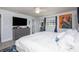 Well-lit bedroom with a dresser and a large mirror at 6100 Gulfport S Blvd # 117, Gulfport, FL 33707