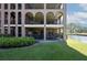 Back of building featuring multiple patios with views of water at 6100 Gulfport S Blvd # 117, Gulfport, FL 33707