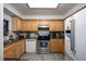 Bright and clean kitchen featuring stainless steel appliances and light wood cabinetry at 6100 Gulfport S Blvd # 117, Gulfport, FL 33707