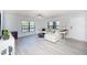 Inviting living room with wood floors, natural light, and a relaxing view at 6100 Gulfport S Blvd # 117, Gulfport, FL 33707