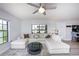Well-lit living room with a view, plush seating, and contemporary décor at 6100 Gulfport S Blvd # 117, Gulfport, FL 33707