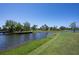 Scenic waterfront with lush landscaping and views of mature trees near the condo complex at 6100 Gulfport S Blvd # 117, Gulfport, FL 33707
