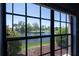 Scenic window view overlooking a tranquil pond and lush landscaping at 6100 Gulfport S Blvd # 117, Gulfport, FL 33707