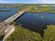 Aerial view of a long bridge surrounded by scenic waterfront views at 611 29Th E St, Bradenton, FL 34208