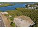 Aerial view of a parking lot next to waterfront and highway at 611 29Th E St, Bradenton, FL 34208