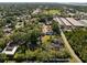 Aerial view that highlights the home's proximity to commercial buildings at 611 29Th E St, Bradenton, FL 34208