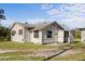 Exterior view of the back of the home with back door and enclosed area at 611 29Th E St, Bradenton, FL 34208