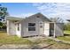 Exterior view of the back of the home with back door and enclosed area at 611 29Th E St, Bradenton, FL 34208