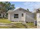 Exterior view of the back of the home with back door and enclosed area at 611 29Th E St, Bradenton, FL 34208