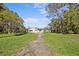 Charming single-story home with a spacious front yard and mature trees at 611 29Th E St, Bradenton, FL 34208