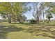 Picturesque backyard with mature trees providing shade and a serene atmosphere at 611 29Th E St, Bradenton, FL 34208