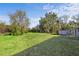 Well-maintained yard with lush grass and mature trees, perfect for outdoor enjoyment at 611 29Th E St, Bradenton, FL 34208