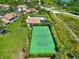 Aerial view of the community tennis courts, providing residents with recreational opportunities at 6339 Bay Cedar Ln # 102, Bradenton, FL 34203