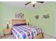 Comfortable bedroom with charming decor, a ceiling fan, and ample natural light at 6339 Bay Cedar Ln # 102, Bradenton, FL 34203