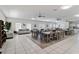 Spacious clubhouse interior with tables, chairs, sofas, and modern ceiling fans for gatherings and events at 6339 Bay Cedar Ln # 102, Bradenton, FL 34203