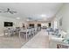 Bright clubhouse interior with large tables, comfortable seating, and a large TV at 6339 Bay Cedar Ln # 102, Bradenton, FL 34203