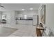 Functional clubhouse kitchen with white cabinets, essential appliances, and ample counter space at 6339 Bay Cedar Ln # 102, Bradenton, FL 34203