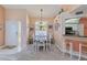Cozy dining area with a view to the kitchen, perfect for Gathering meals and entertaining at 6339 Bay Cedar Ln # 102, Bradenton, FL 34203