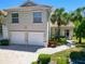 Beautiful home with a two-car garage, landscaped entryway, and well-maintained front yard at 6339 Bay Cedar Ln # 102, Bradenton, FL 34203