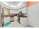 Bright kitchen with stainless steel appliances, white cabinetry, and a functional layout, designed for convenience and style at 6339 Bay Cedar Ln # 102, Bradenton, FL 34203