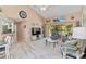 Spacious living room with vaulted ceilings, comfortable seating, and easy access to the dining area at 6339 Bay Cedar Ln # 102, Bradenton, FL 34203
