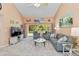 Inviting living space with vaulted ceilings, a sliding glass door to the lanai, and a relaxing atmosphere at 6339 Bay Cedar Ln # 102, Bradenton, FL 34203