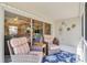 Screened in sunroom with comfortable seating and view of interior and back yard at 6339 Bay Cedar Ln # 102, Bradenton, FL 34203