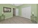 Bright bedroom featuring laminate flooring and a double door closet at 6524 Willowshire Way, Bradenton, FL 34212