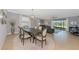 Elegant dining area with ample seating, chandelier, and access to living space at 6524 Willowshire Way, Bradenton, FL 34212