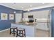 Charming kitchen featuring granite countertops, stainless steel appliances, and stylish pendant lighting at 6524 Willowshire Way, Bradenton, FL 34212