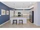 Modern kitchen with granite countertops, stainless steel appliances, and breakfast bar at 6524 Willowshire Way, Bradenton, FL 34212