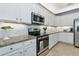 Well-appointed kitchen with granite countertops, stainless steel appliances, and plenty of storage space at 6524 Willowshire Way, Bradenton, FL 34212
