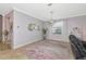 Spacious living room featuring stylish decor, tile floors, and soft purple walls at 6524 Willowshire Way, Bradenton, FL 34212