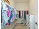 Well-organized walk-in closet with ample shelving and hanging space for clothes and accessories at 6524 Willowshire Way, Bradenton, FL 34212