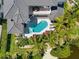 Bird's eye view of the pool and spa with patio and lounge chairs at 7118 Hawks Harbor Cir, Bradenton, FL 34207