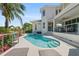 Backyard with pool, spa, and lounge chairs, perfect for outdoor entertaining and relaxation at 7118 Hawks Harbor Cir, Bradenton, FL 34207