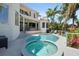 Lush backyard with pool, spa, and covered patio, ideal for enjoying the outdoors at 7118 Hawks Harbor Cir, Bradenton, FL 34207