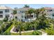 An aerial view of a stunning home and lush tropical landscaping surrounding the backyard pool and spa at 7118 Hawks Harbor Cir, Bradenton, FL 34207