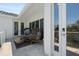 Inviting balcony features comfortable seating and a tranquil view, perfect for relaxation at 7118 Hawks Harbor Cir, Bradenton, FL 34207