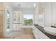 Primary bathroom with double sinks, a soaking tub, and a glass enclosed shower at 7118 Hawks Harbor Cir, Bradenton, FL 34207
