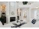 Bright open floor plan living room with fireplace, modern decor, and high ceilings at 7118 Hawks Harbor Cir, Bradenton, FL 34207