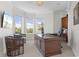 Spacious home office with a large desk, comfortable seating, and built-in storage at 7118 Hawks Harbor Cir, Bradenton, FL 34207
