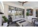 Stylish outdoor living space boasts comfortable seating, a modern fireplace, and serene views at 7118 Hawks Harbor Cir, Bradenton, FL 34207