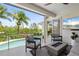 Covered patio overlooking the pool with ample space for lounging and entertaining at 7118 Hawks Harbor Cir, Bradenton, FL 34207